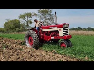 560 Diesel plowing with 4/14 fast hitch plow.