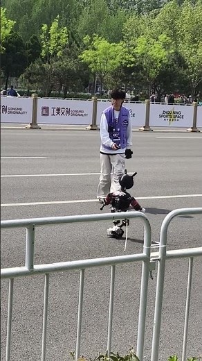 The robot baby is running a marathon, so cute!