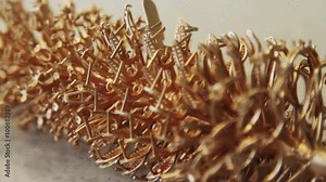 The shape of gold ornaments after pouring gold. Production and making manufacturing, factory, cast craft design, process precious gold jewelry, diamond, jewels, ring jeweler, goldsmith in workshop.
