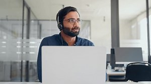 clip-3430170631-busy-indian-call-center-agent-wearing-headset