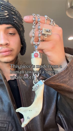 @account.n_666 on Instagram: "Human jaw and sperm whale tooth pendant - Displays five 14k gold studs around the bail along with a pink tourmaline accent - The back features a 18th century small religious colored glass accent - The jaw comes from ex medical Germany where it was used teaching future doctors - All 925 sterling silver - • • • • • • • • • • • • • • • • • #avantgarde #jewelry #humanbones #skull #gothic"