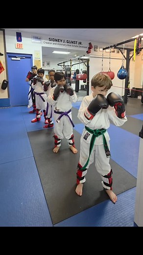 Defensive movements for kids kickboxing include blocking with hands and legs, parrying to redirect punches, slipping the head to the side of an attack, and ducking or bobbing to evade high punches. #rogerdabney #karate #kickboxing #competitiveedgekarate #taekwondo #martialarts #boxing | Competitive Edge Karate