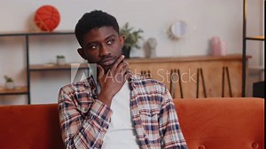 Eureka. Thoughtful clever inspired african american man make gesture raises finger came up with creative plan feels excited with good idea, inspiration motivation. Young guy at home in living room