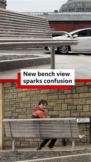 Look at that view! This new bench in Bristol city centre has sparked some confusion over its placement - right in front of a wall. The council say it's been put there primarily as a resting place, but would keep it under review. | BBC Bristol