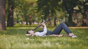 Girl Plays Clarinet While Lying On Stock Footage Video (100% Royalty-free) 1085747447 | Shutterstock