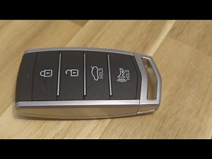 How to replace the battery in the remote control of the Genesis G90?
