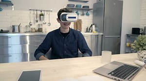 clip-25634036-young-boy-vr-goggle-watching-video-sitting
