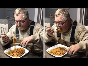 Man Eats Spaghetti With Scissors