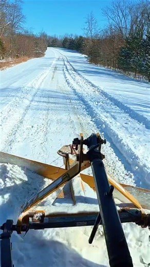 Back blading snow. #snowremoval #backblading #tractorlife #winterwork #kubota #dji #construction
