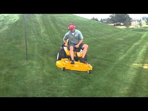 Walker zero-turn mower effortlessly mowing on 25 degree slope