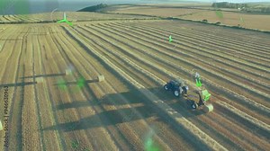 Agricultural technology icons animation over tractor working in harvested field