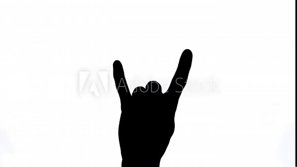 Male hand raised showing a heavy metal rock sign. Rock'n'roll concept. Close-up, isolated, black and white