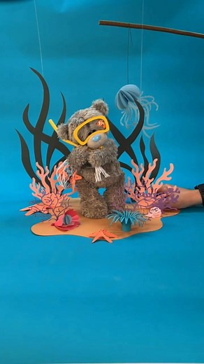 🎬 Behind the Scenes: The Magic of Tatty Teddy’s Calendar World! Countless hours go into designing, cutting, folding, and crafting every tiny paper prop that brings Tatty Teddy’s world to life. From hand-made flowers to miniature fish and coral, every detail is carefully built for that perfect shot. 🌸 💙 Once the props are ready, it’s time to set the scene and make sure Tatty Teddy is picture-perfect for his calendar debut! ✨ 📅 Don’t miss out — get your Tatty Teddy calendar now before the new