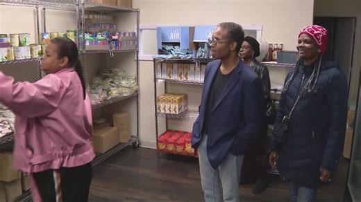 Jesse Jackson Jr. helping to hand out turkeys to needy during Thanksgiving week, fulfilling father’s request