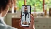 Video call, smartphone screen and doctor talking to patient for...