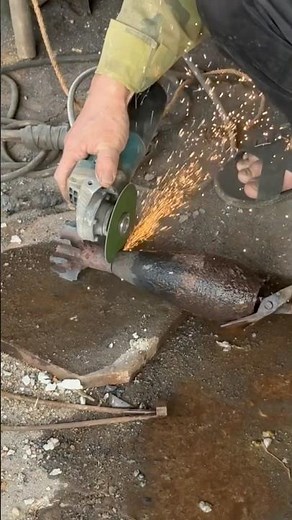 Cutting the tail of an 81 mortar shell to make a knife