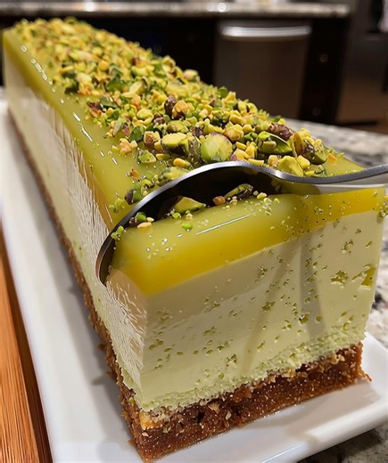 Matcha White Chocolate Mousse Cake Ingredients: - 1 cup (240 ml) heavy cream - 4 oz (113 g) white chocolate, chopped - 2 tbsp matcha powder (plus extra for dusting) - 2 large eggs, separated - 1/4 cup (50 g) granulated sugar - 1/2 cup (120 ml) milk - 1/2 tsp vanilla extract - 1/4 tsp salt - 1 pre-baked cake layer (sponge or vanilla cake) Instructions: 1. Start by melting the white chocolate. Place the chopped white chocolate in a heatproof bowl over a pot of simmering water (double boiler method
