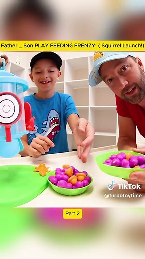 Father and Son's Fun Feeding Frenzy with Squirrels