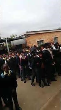 School assembly Zion hymns..