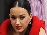 Katy Perry struggles to take off a plunging, red $7.4K Bottega Veneta dress