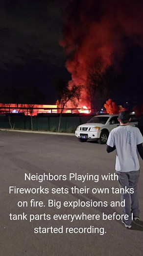 Neighbors Playing with Fireworks sets their own tanks on fire. Big explosions and tank parts everywhere before I started recording. #arizona