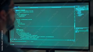 Busy business man software developer engineer working on desktop computer in dark night office. Male administrator programmer specialist coding on pc developing applications, screen with code