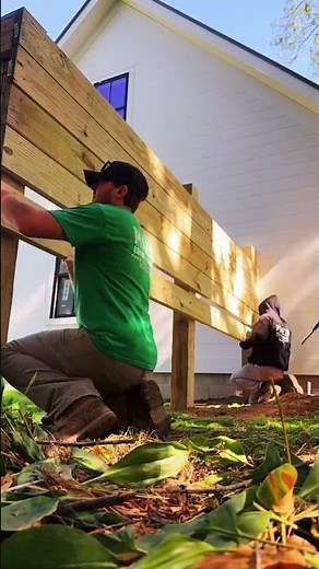 Horizontal privacy fence installed with 6x6 posts and 2x8 framing.