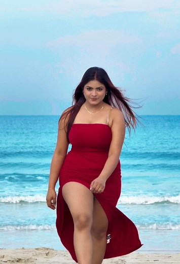 Stunning Beach Walk: Woman in Red Dress