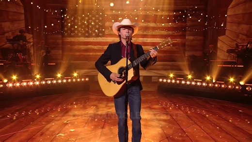 A live video shows John Foster singing the famous patriotic anthem for a cheering audience. The performance focused on themes of national pride and freedom. Fans enjoyed the artist's respectful version of the track originally made famous by Toby Keith. | The Grand Ole Gazette | Facebook