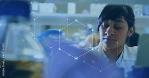 Animation of scientific data processing over biracial female scientist in laboratory