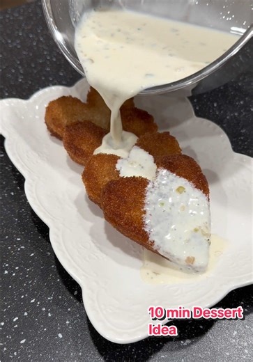 Instant Shahi Tukda Recipe Method: Heat 1.5 cups of milk along with 2 tbso sweetened condensed milk and 1/2 tsp cardamom powder. After 5 minutes combine 2 tsp corn flour with 2 tbso milk. Add this slurry in milk mixture. Cook 10 minutes on low heat. Set this aside Cut bread into heart shape and fry until golden brown. Set this aside Prepare sugar syrup with 1/2 cup sugar and half cup water. Cook for 5 minutes set this aside. Assemble as shown in video #foryou #viral #trendingvideo #fyp #trending