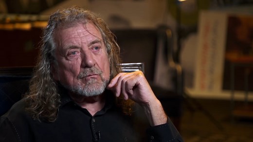 Robert Plant opens up about how Led Zeppelin's "All My Love" was a tribute to his son Karac, who passed away at a young age. He tells Dan Rather about how the band helped him through the grief of losing his son, and how his son still pops up in songs that Led Zeppelin put out afterwards. | AXS TV