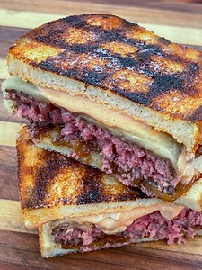 Old school diner-style patty melt with Snake River Farms American Wagyu beef, caramelized onions, and homemade thousand-island-ish dressing. Served on toasted sourdough. #americanwagyu #wagyu #thegrilldads #throwitonthegrill #snakeriverfarms #cheeseburger #grilling | The Grill Dads