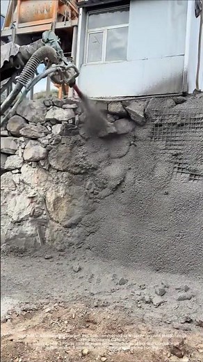 High-pressure shotcrete recording: exposed rock wall instantly covered with "armor"