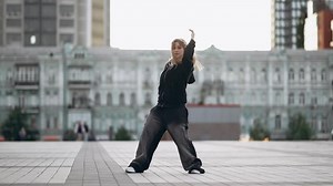 Young woman dancing hip hop on the street.