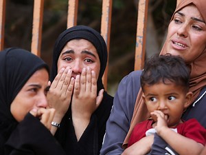 Israeli forces open fire at Gaza food sites, killing at least 13 Palestinians