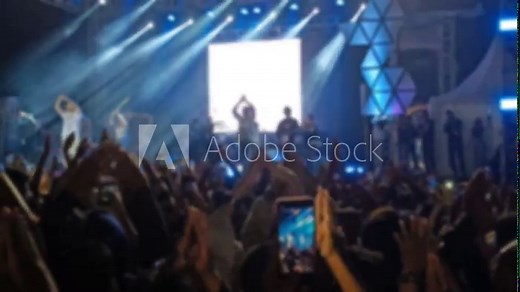 Defocused Abstract Background of Cheering concert crowd with colorful stage light, silhouette of Large group of people audience at live music festival Stock Video