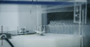 Transfer to injection packaging line. Pharmaceutical production line, manufacturing row, belt or conveyor. Pharmacy factory. Healthcare and automated technology concept.