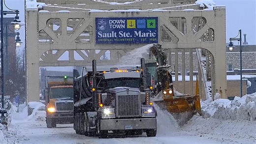 City of Sault Ste. Marie, MI crews working hard today clearing snow banks from sidewalks and blowing the snow into waiting dump trucks. We appreciate the hard work during this difficult winter in trying to keep up! The area will see a lot of traffic through this weekend with the I-500 taking place! | I Love Sault Ste. Marie, Michigan