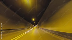 Hyperlapse accelerated POV vehicle drive into a tunnel, asphalt road, fast speed car travel gopro point of view