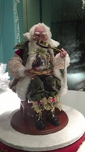 Santa is inspecting a Nativity ornament. He knows how important this one is, as it reflects the true meaning of Christmas. I called him Finishing Touches Santa because Santa is in charge of all the finishing touches at Christmas. You can find him at your favorite retailer, or here at our MarketPlace. https://www.markrobertsmarketplace.com/?s=51-77850&post_type=product The rotating base is seperate. | Mark Roberts