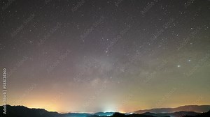 Amazing nature Time lapse Milky way galaxy stars, Night to day Timelapse seen in Phang Nga Thailand, Beautiful Nature in the night sky. 4K Colorful clouds sky sunrise over mountains landscape