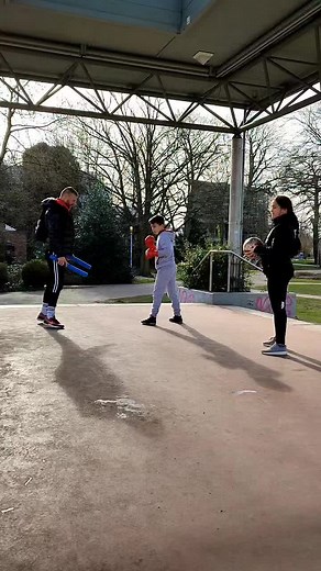 Outdoor Game Sequence with Blue Object and Ball