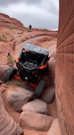 Orange Maverick X3 squeezing through the canyon like it’s built for war #OffRoad #RockCrawling #4x4
