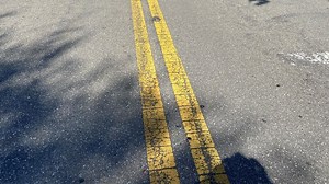 Is passing a cyclist on double-yellow line allowed?