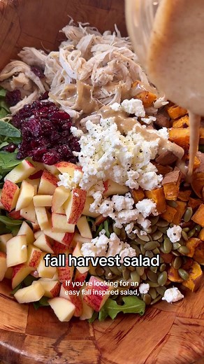 This chopped fall harvest salad has mixed greens, chicken, roasted sweet potatoes, apples, dried cranberries, pumpkin seeds, goat cheese, and is tossed with a creamy orange vinaigrette. It’s full of different flavors and textures, packed with protein (38 grams in one serving!), and perfect for autumn. Prep the ingredients in advance and toss them together for an easy meal! Full recipe on Eat the Gains! #chickensalad #salad #easyrecipes #mealprep #healthyrecipes #highprotein #lunchideas
