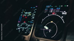 Aircraft cockpit instruments turned on and becoming to life in dark cockpit environment