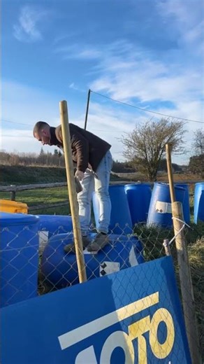Worker slips while hammering on rolling container in Falaise, France