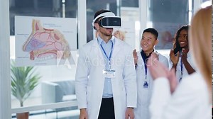 Caucasian professional doctor therapist physician showing new presentation virtual reality headset wearing presenting to medical staff applauding approving his work. Future technologies.