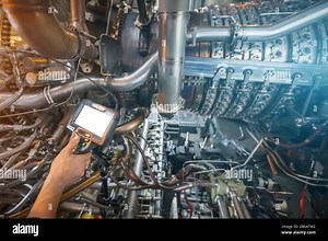 Inspection of a gas turbine engine using a Video Endoscope. Search for defects inside the turbine and shooting on video, photos using a measuring inst Stock Photo - Alamy